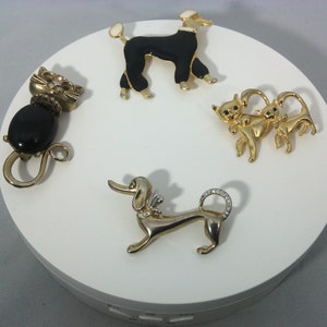 vintage dog or cat brooches