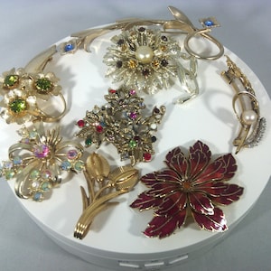 Vintage brooches in the shape of a simple flower or bouquet