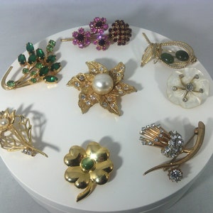 Vintage brooches in the shape of a simple flower or bouquet