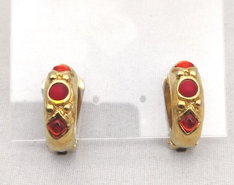 signed MICRIS these vintage hoop style clip-on earrings in gold metal and red rhinestones
