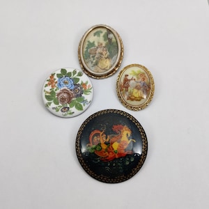vintage brooch with porcelain style decorations