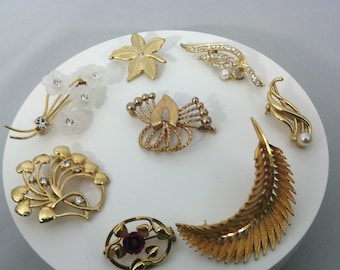 vintage flower and plant brooches, some with signatures