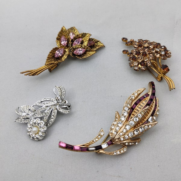 Vintage brooches in the shape of a simple flower or bouquet