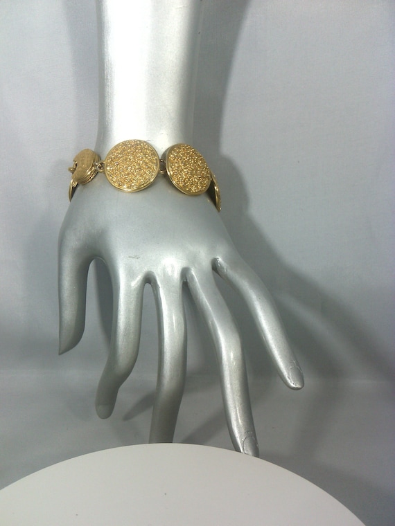 Signe YVES SAINT LAURENT bracelet a pastilles ouvragees en metal dore Etsy France