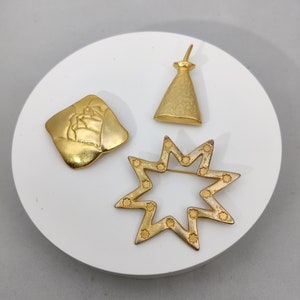 Signerad LANCOME PARIS vintage guldfärgad metallbrosch
