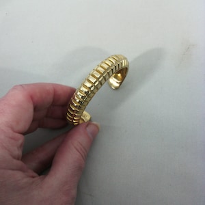 open bangle bracelet in vintage gold metal