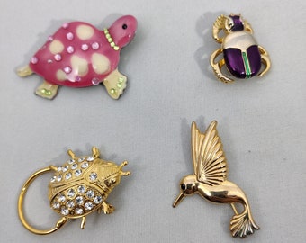 Vintage zoomorphic gold metal brooches