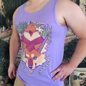 May include: A purple tank top with a graphic of a red fox with green foliage. The fox has a red, orange, and yellow color scheme.
