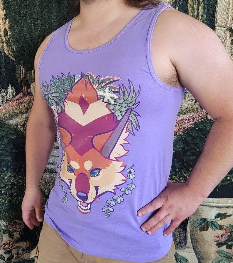 May include: A purple tank top with a graphic of a red fox with green foliage. The fox has a red, orange, and yellow color scheme.