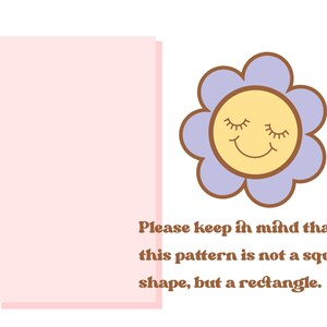 May include: A light pink rectangle with the text "Please keep in mind that this pattern is not a square shape, but a rectangle."  A purple flower with a yellow smiling face is to the right of the rectangle.