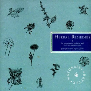 May include: A book cover with a blue background and the title "Herbal Remedies: An introduction to herbs and their therapeutic uses" in white text. The cover also features a variety of black and white illustrations of herbs and flowers.