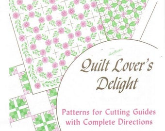 May include: A vintage quilt pattern book with a white background and green and pink floral designs. The title is "Quilt Lover's Delight" with the text "Patterns for Cutting Guides with Complete Directions". The book includes 7 applique and 10 pieced patterns. The book number is 3540.