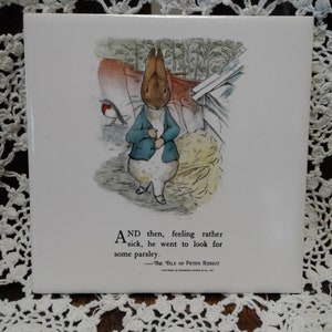 May include: A vintage illustration from The Tale of Peter Rabbit, featuring a blue-jacketed rabbit with brown ears, standing in a garden setting. The text reads: "AND then, feeling rather sick, he went to look for some parsley. -THE TALE OF PETER RABBIT"