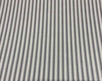May include: White fabric with thin black stripes. The stripes are evenly spaced and have a subtle dotted pattern.