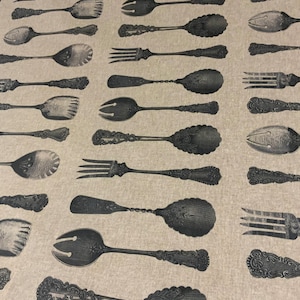 May include: A beige fabric with a repeating pattern of black vintage silverware, including forks, spoons, and serving spoons.