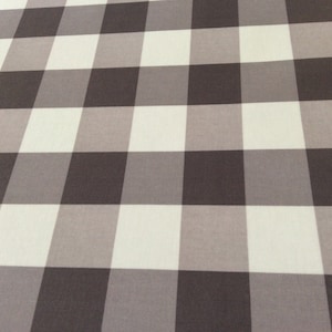 May include: A white and brown checkered fabric with a subtle gradient in the brown squares.