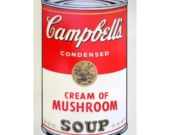 May include: A Campbell's Cream of Mushroom Soup tin with a red top and the Campbell's logo in white script. The tin has a white label with the words "Cream of Mushroom Soup" in red and black.
