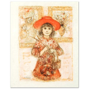 May include: A young girl in a red dress and a red hat holds a sprig of wheat in her hand. She is standing in front of two framed pictures, one with a woman and child, and the other with a vase of flowers.