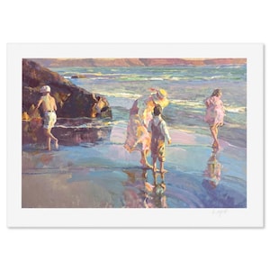 May include: A framed print of a beach scene with figures. The artwork depicts a woman and two children on a sandy shore, with a child wading in the water. The color palette includes blues, pinks, and yellows, evoking a sunny day at the beach.