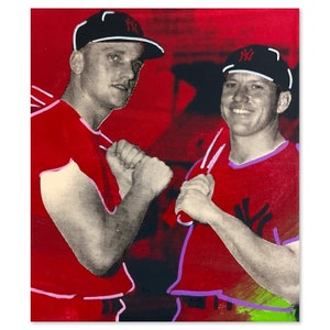 May include: Two men wearing red baseball uniforms with the New York Yankees logo on their caps and jerseys. The men are standing side by side, with their arms raised in a fist bump.
