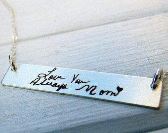 May include: Silver necklace with a rectangular pendant engraved with the handwritten message "Love You Always Mom" and a small heart.