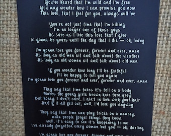 May include: Black chalkboard with white text, a song lyric by Randy Travis, "Forever and Ever, Amen". The lyrics are about love and how long it will last.