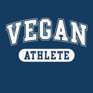 May include: White text on a blue background reads "VEGAN ATHLETE" in a vintage collegiate style font.