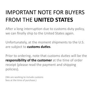 May include: White text on a white background. The text reads "IMPORTANT NOTE FOR BUYERS FROM THE UNITED STATES." Additional text explains that shipments to the U.S. are subject to customs duties and the customer is responsible.