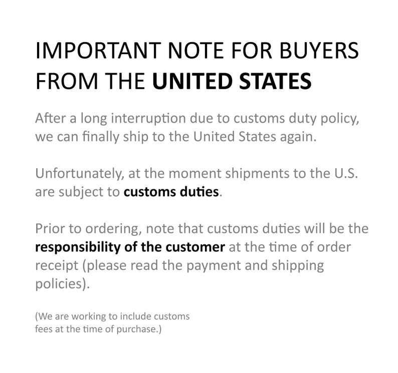 May include: White text on a white background. The text reads "IMPORTANT NOTE FOR BUYERS FROM THE UNITED STATES." Additional text explains that shipments to the U.S. are subject to customs duties and the customer is responsible.
