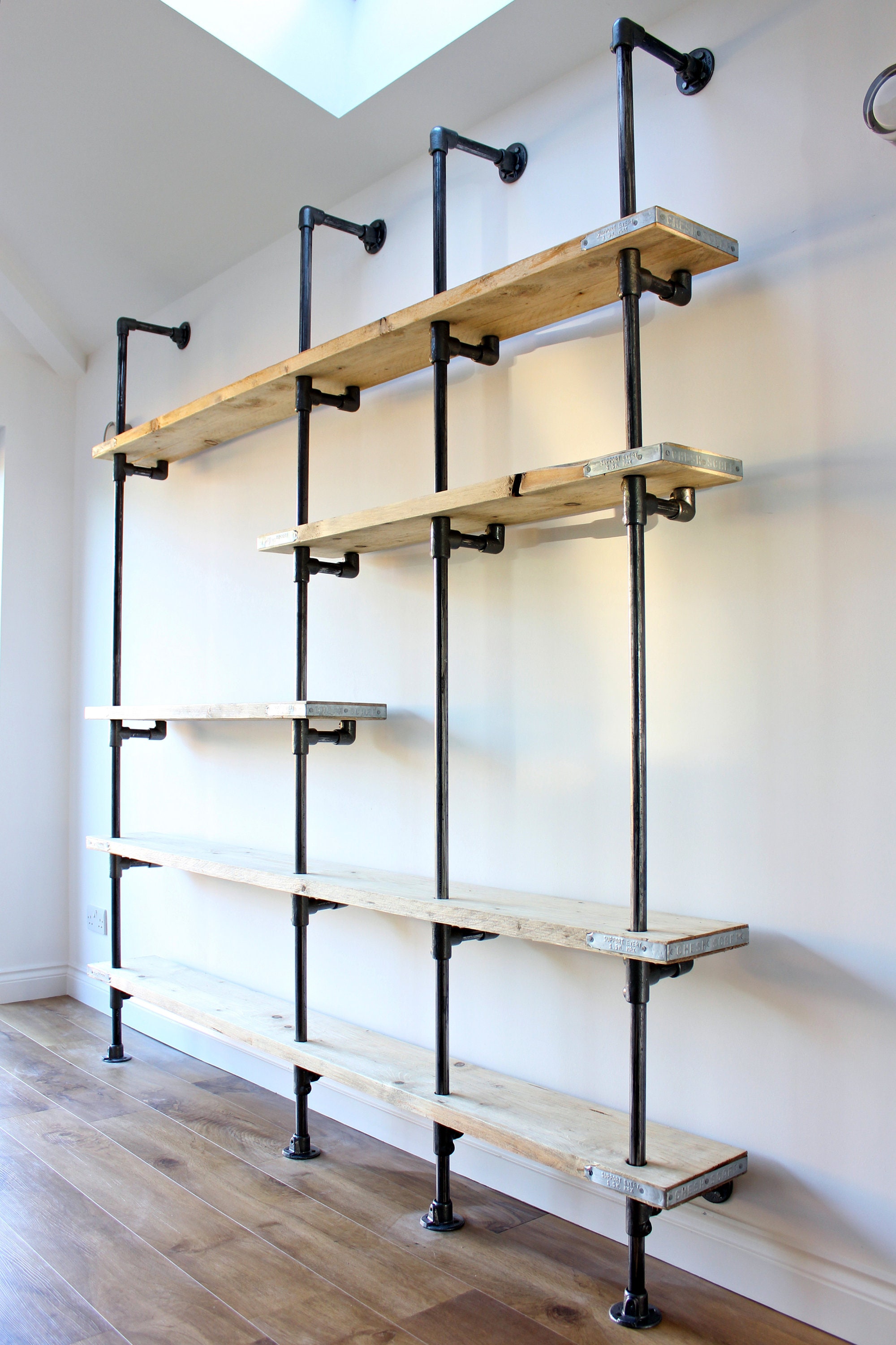 Wesley Scaffolding Boards and Dark Steel Pipe Wall Mounted and