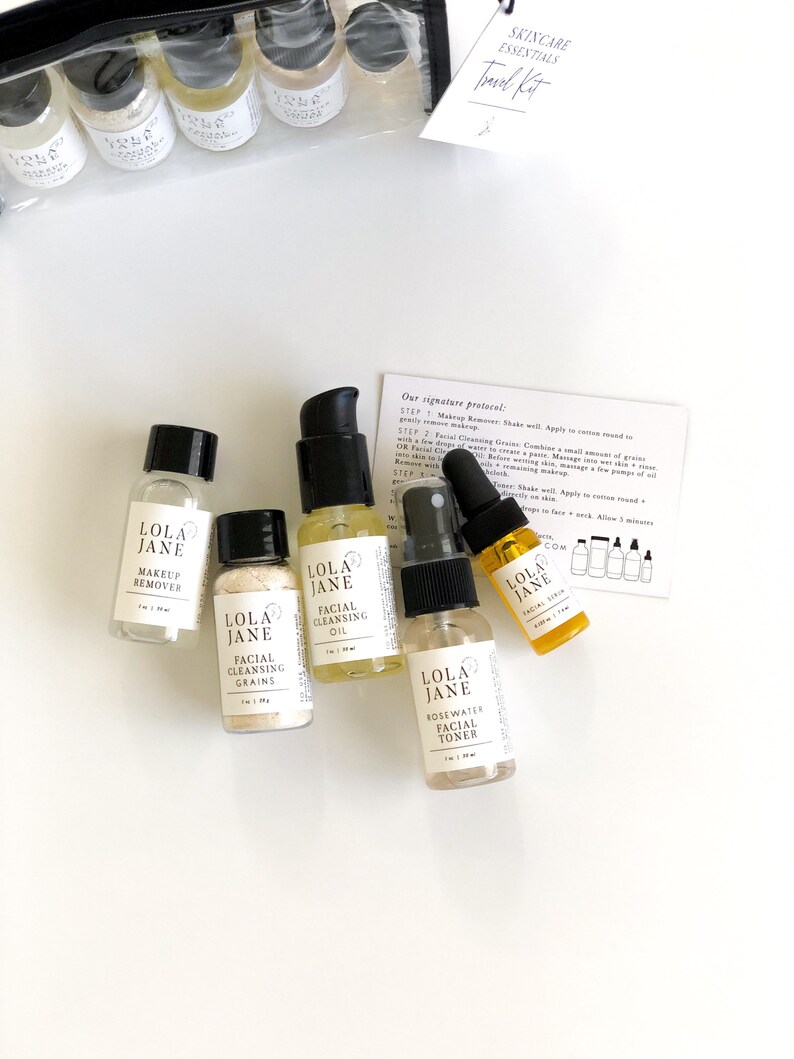 May include: A skincare essentials travel kit with several small bottles and jars. The bottles contain makeup remover, facial cleansing oil, facial cleansing grains, rosewater facial toner, and facial serum. The kit includes a clear travel bag and a card with instructions.