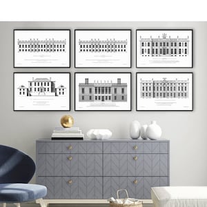May include: Six framed black and white architectural prints of buildings are displayed on a white wall. The prints are above a gray dresser with gold knobs. A blue chair, a woven basket, and a white ottoman are in front of the dresser.