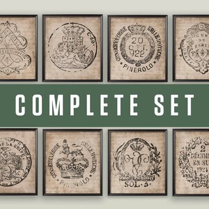 May include: A set of eight framed prints featuring vintage black and white illustrations of various crests and seals. The prints are all framed in black and have a distressed, antique look.