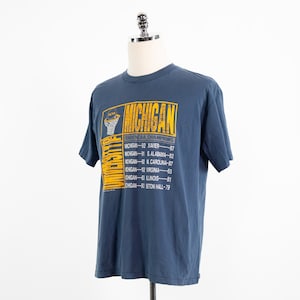 Vintage University of Michigan NCAA Basketball 1989 National Champions Blue Nutmeg Mills T-Shirt Large/X-Large Wolverines U of M UM