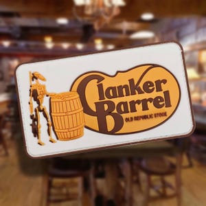 May include: A rectangular patch with a white border features the words "Clanker Barrel Old Republic Store" in brown and orange. A droid figure and a wooden barrel are on the left side of the patch.