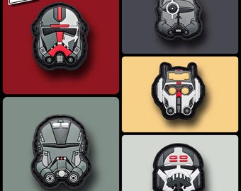May include: Five patches with detailed helmet designs in red, grey, and white. The patches are set against red, grey, and yellow backgrounds. The "WSF" logo is in the top left corner. The patches are likely for clothing or accessories.
