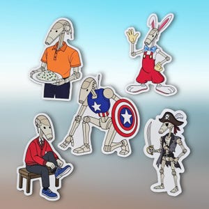 May include: A collection of five cartoon robot stickers. One robot wears an orange polo shirt and carries a plate of food. Another is dressed as a superhero with a shield. Other robots are dressed as a pirate, a person in a red sweater, and a rabbit.