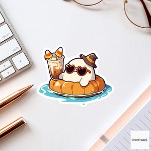 May include: A sticker featuring a white ghost wearing a black witch hat and heart-shaped sunglasses, floating in a pumpkin-shaped inner tube on blue water while holding a clear plastic cup filled with a brown beverage and two candy corn pieces.