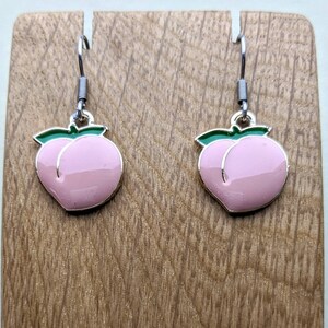 Cute little peach earrings with stainless steel hooks.