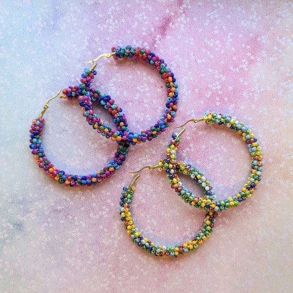 Large gold stainless steel rainbow beaded seed bead hoops. Colourful.
