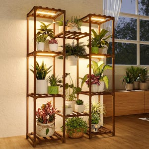 May include: A multi-tiered, dark brown wooden plant stand with built-in LED lighting. The stand is filled with various potted plants, showcasing a variety of green foliage and colorful flowers. The design is ideal for indoor plant display.