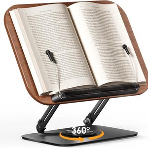 May include: A wooden book stand with a black metal frame holds an open book. The stand features adjustable arms and a 360-degree rotating base. The book is held in place by clear plastic arms. The stand is designed for reading and studying.