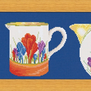 May include: Three ceramic pitchers with a blue and white floral design. The pitchers have yellow, orange, and white accents. The pitchers are arranged in a row on a blue background.