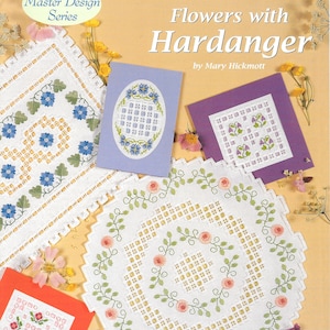 May include: A book cover with a white background and a floral design. The title is "Flowers with Hardanger" by Mary Hickmott. The book is part of the "Master Design Series".