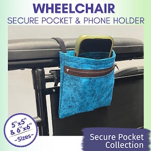 May include: A blue patterned wheelchair secure pocket and phone holder with a brown zipper. The pocket is holding a phone. The text on the image reads "WHEELCHAIR SECURE POCKET & PHONE HOLDER" and "Secure Pocket Collection". Sizes are 5"x5" and 6"x6".