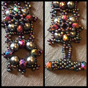 May include: A close-up of a beaded bracelet featuring iridescent purple, green, and black beads. The bracelet is crafted with small seed beads and larger pearl-like beads.