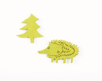 hedgehog felt brooch accompanied by forest