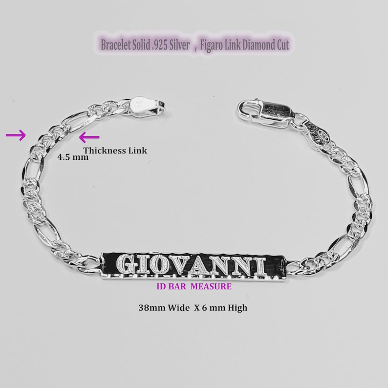 May include: Silver Figaro chain bracelet with a personalized nameplate bar that reads "GIOVANNI". The bar measures 38 mm wide by 6 mm high. The chain is 4.5 mm thick.