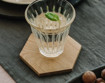 Hexagonal wooden coasters made of oak for glasses, cups or bottles in a set of 4