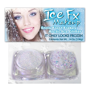 May include: Two small jars of white glitter, one with fine glitter and one with larger, iridescent flakes. The jars are labelled "Ice Fx Makeup", "Snow Frost Flakes", "Arctic Ice Glitter", and "It Only Looks Frozen". The label also states "Contents: Net Wt. .14 Oz. (3.96g)".